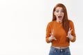 Excited and shocked young worried woman telling something bad happened, retell story with nervous expression, shaking Royalty Free Stock Photo