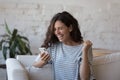 Excited smartphone user woman receiving good happy news