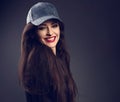 Excited smiling beautiful brunette woman in baseball blue cap wi Royalty Free Stock Photo