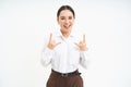 Excited smiling businesswoman, asian female employee, has fun, shows heavy metal, rock n roll gesture, celebrates, white