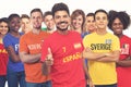 Excited spanish football fan with group of other european supporters Royalty Free Stock Photo