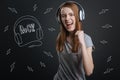 Excited student loving rock music and looking happy Royalty Free Stock Photo