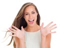 So excited. Studio portrait of a beautiful young woman standing against a white background. Royalty Free Stock Photo