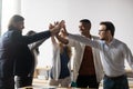 Excited successful diverse business people giving high five, celebrating win Royalty Free Stock Photo