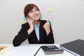 Excited or surprised business woman talking with someone on smart phone while sitting at her office. Royalty Free Stock Photo