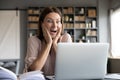 Excited surprised woman looking at laptop screen, reading news Royalty Free Stock Photo