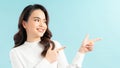 Excited and surprised young happy woman astonished pointing looking left side blank space for your promo Royalty Free Stock Photo