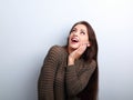 Excited surprising young woman with open mouth looking up Royalty Free Stock Photo