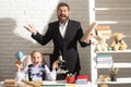 Excited teacher with amazed school girl in school lesson. Little student schooling. Happy funny school children. Excited Royalty Free Stock Photo