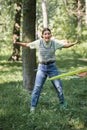 Excited teen girl twisting hula hoop