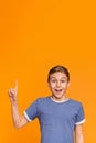 Excited teenage boy have great idea, pointing finger up Royalty Free Stock Photo