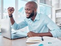 So excited to begin this project. a young businessman cheering while working on his laptop. Royalty Free Stock Photo