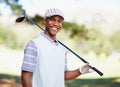 Excited to get back on the course. Portrait of a confident african american golf player holding a driver over his Royalty Free Stock Photo