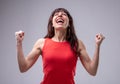 Excited woman celebrating with clenched fists Royalty Free Stock Photo