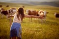 Excited woman exploring the countryside Rural tourism concept