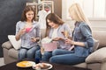 Excited woman getting gift from her friends