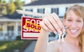 Excited Woman Holding House Keys and Sold For Sale Real Estate S Royalty Free Stock Photo
