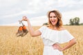 Excited woman holding new shoes that she found on sale Royalty Free Stock Photo