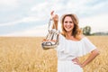 Excited woman holding new shoes that she found on sale Royalty Free Stock Photo