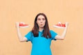 Excited Woman Holding a Pair of Red Sport Shoes Royalty Free Stock Photo