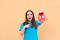 Excited Woman Holding a Pair of Red Sport Shoes Royalty Free Stock Photo