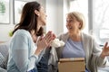 Excited woman informs mom that she will become a grandmother