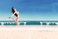 Excited woman leaping at beach Royalty Free Stock Photo