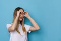 Excited Woman Making Binoculars Hands Royalty Free Stock Photo