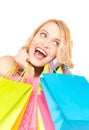 Excited woman with shopping bags Royalty Free Stock Photo