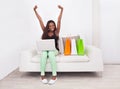 Excited woman shopping online at home