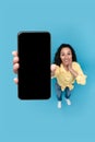 Excited Woman Showing Big Cellphone Screen Over Blue Background, Vertical Royalty Free Stock Photo