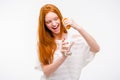 Excited woman squeezing orange juice into a glass by hand Royalty Free Stock Photo