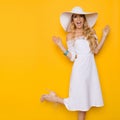 Excited Woman In Sumer Dress And Hat Is Standing On One Leg And Shouting Royalty Free Stock Photo