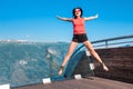 Excited woman tourist at Stegastein Viewpoint Royalty Free Stock Photo