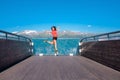 Excited woman tourist at Stegastein Viewpoint Royalty Free Stock Photo