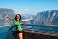 Excited woman tourist at Stegastein Viewpoint Royalty Free Stock Photo