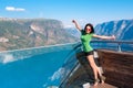 Excited woman tourist at Stegastein Viewpoint Royalty Free Stock Photo