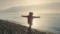 Excited woman turning around on beach. Happy girl dancing at seaside Royalty Free Stock Photo