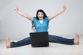 Excited woman using laptop