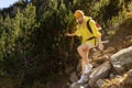 Excited woman walking through landscape outdoors. An active girl enjoys her Royalty Free Stock Photo