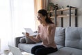 Excited woman wearing glasses reading letter with good news Royalty Free Stock Photo