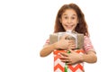 Adorable young girl with a Christmas present