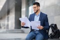 Excited young arab man getting ready for job interview