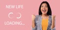 Excited young Asian woman gesturing YES on pink studio background with NEW LIFE loading throbber icon, collage Royalty Free Stock Photo