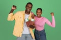 Excited young black people tourists showing tickets and passports