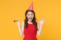 Excited young brunette woman girl in red summer dress, birthday hat posing isolated on yellow wall background studio Royalty Free Stock Photo