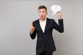 Excited young business man in suit holding say cloud with lightbulb, index finger up with great new idea isolated on Royalty Free Stock Photo