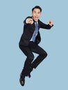 Excited young  businessman jumping in air Royalty Free Stock Photo