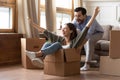 Happy couple have fun on moving day to new home Royalty Free Stock Photo