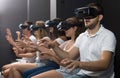 Excited man experiencing with friends virtual reality